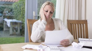 Stressed-woman-planning-finances-bills-and-debt